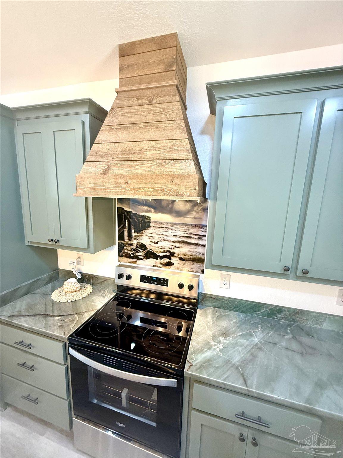 4035 Charles Circle Pace, FL 32571 - Photo 12 of 68 a stove top oven sitting inside of a kitchen