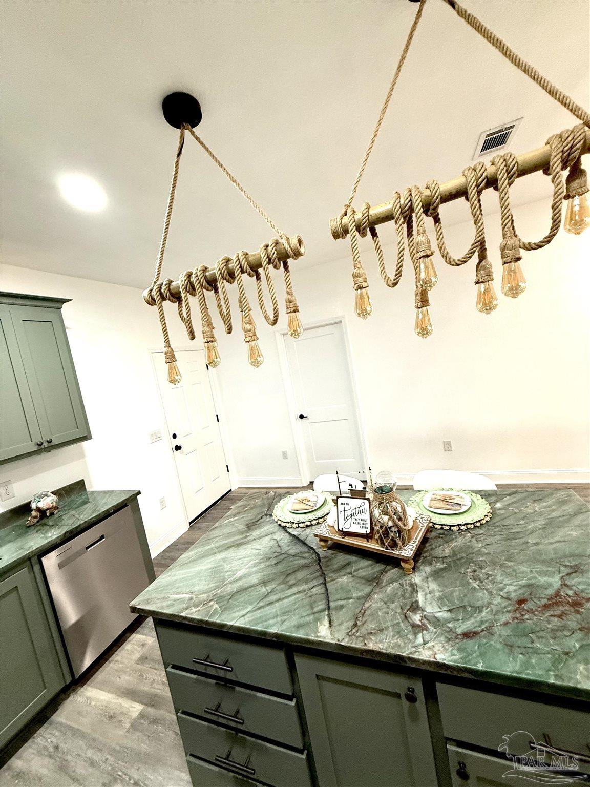 4035 Charles Circle Pace, FL 32571 - Photo 13 of 68 a room with a table and chairs