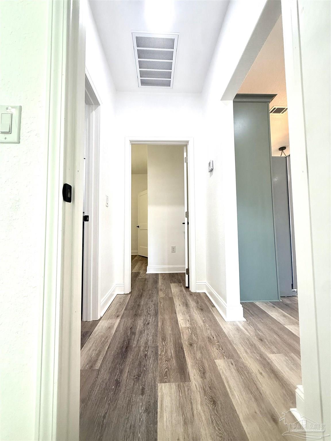 4035 Charles Circle Pace, FL 32571 - Photo 20 of 68 a view of a hallway with wooden floor