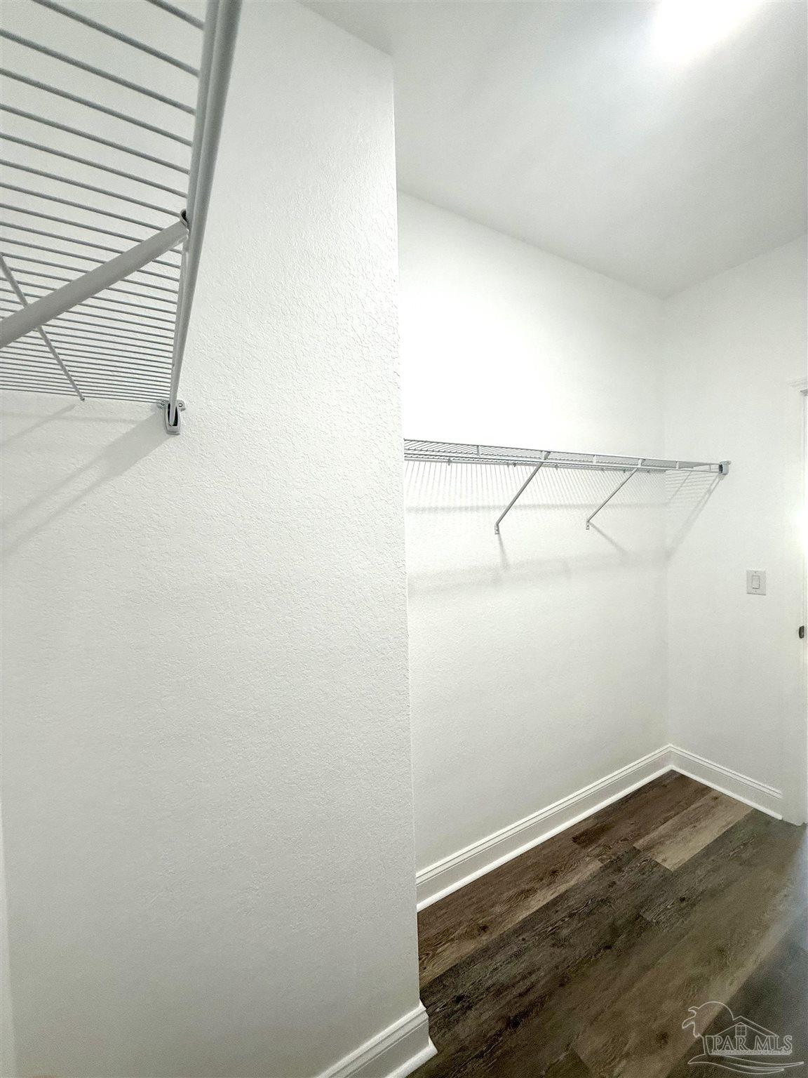 4035 Charles Circle Pace, FL 32571 - Photo 38 of 68 a view of small space with racks on the wall