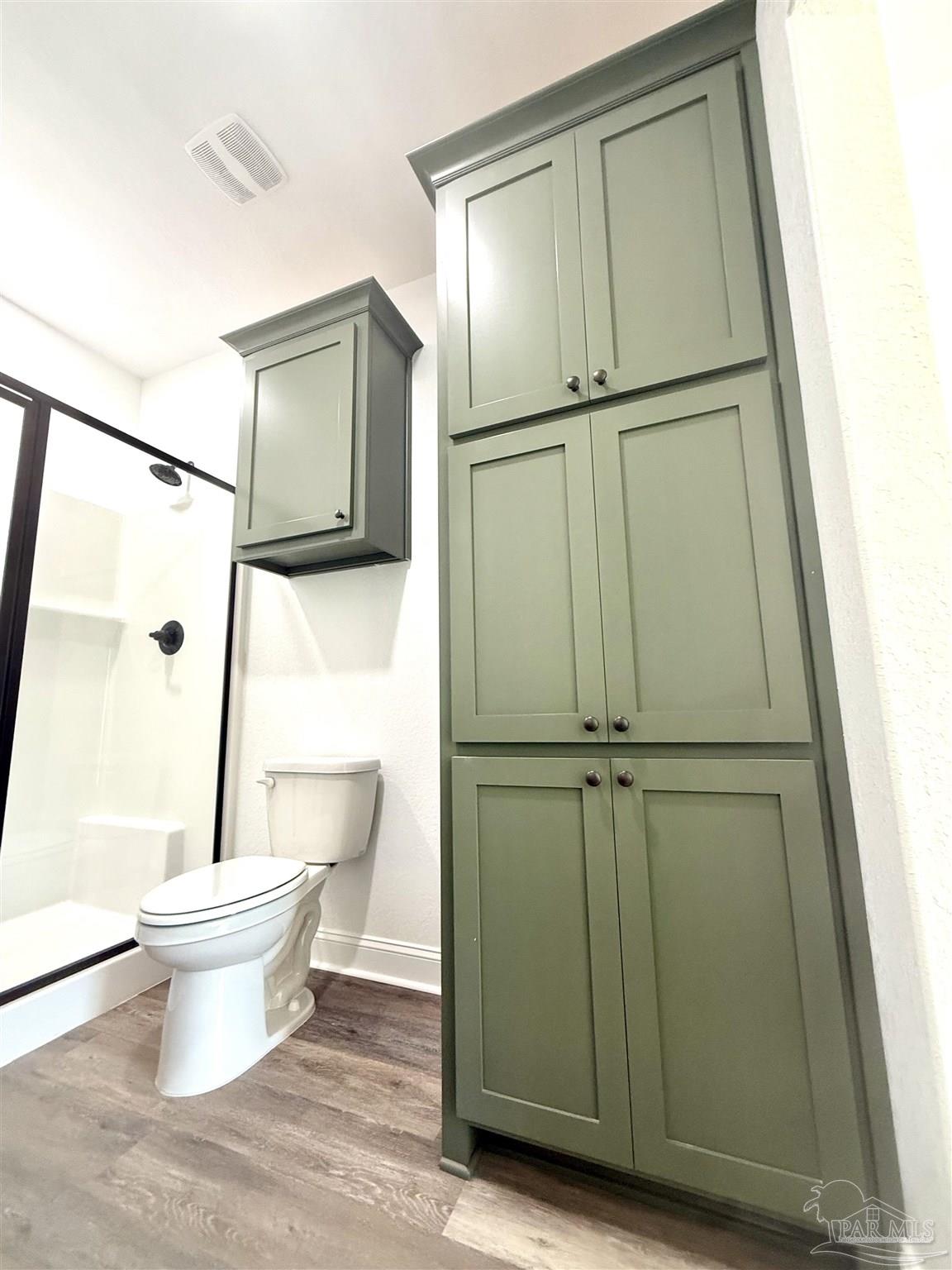 4035 Charles Circle Pace, FL 32571 - Photo 46 of 68 a bathroom with a toilet and a mirror