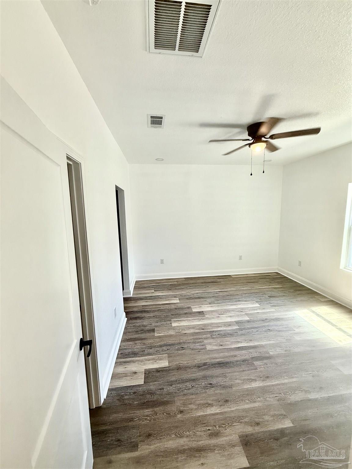 4035 Charles Circle Pace, FL 32571 - Photo 50 of 68 a view of a room with wooden floor and staircase