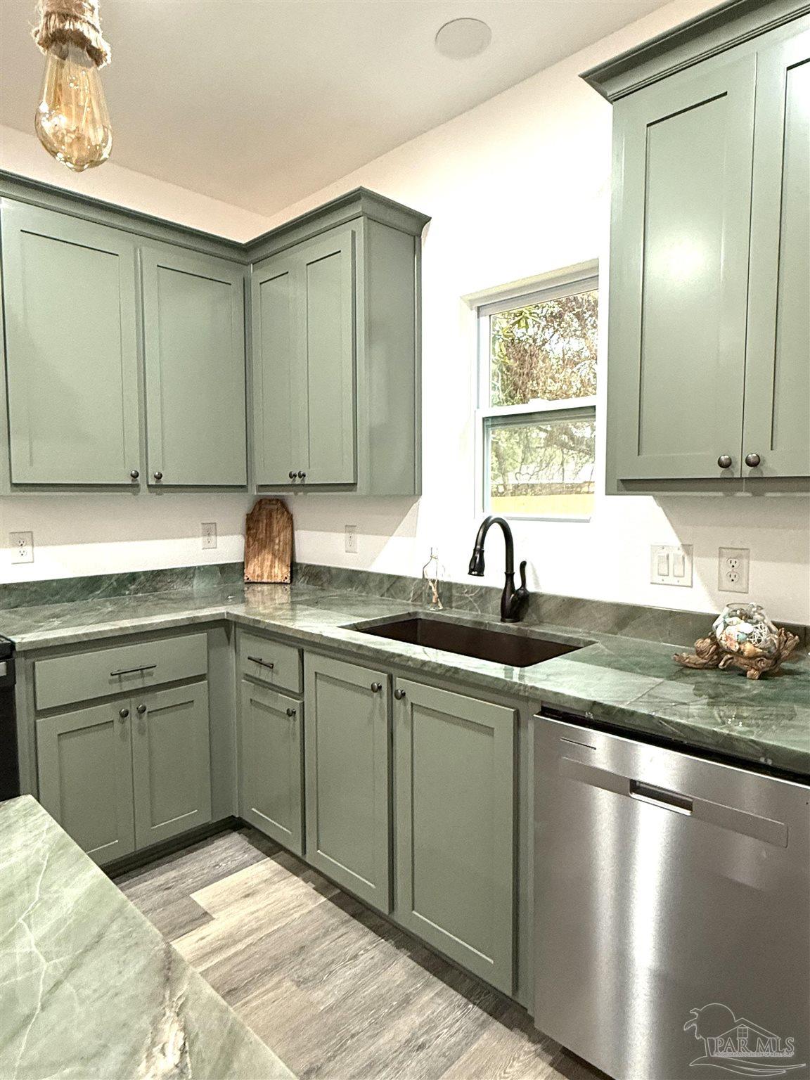 4035 Charles Circle Pace, FL 32571 - Photo 60 of 68 a kitchen with sink and window