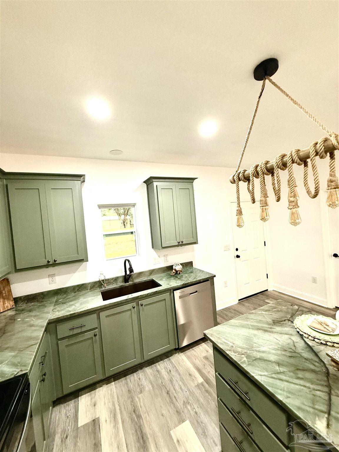 4035 Charles Circle Pace, FL 32571 - Photo 64 of 68 a kitchen with a sink and cabinets