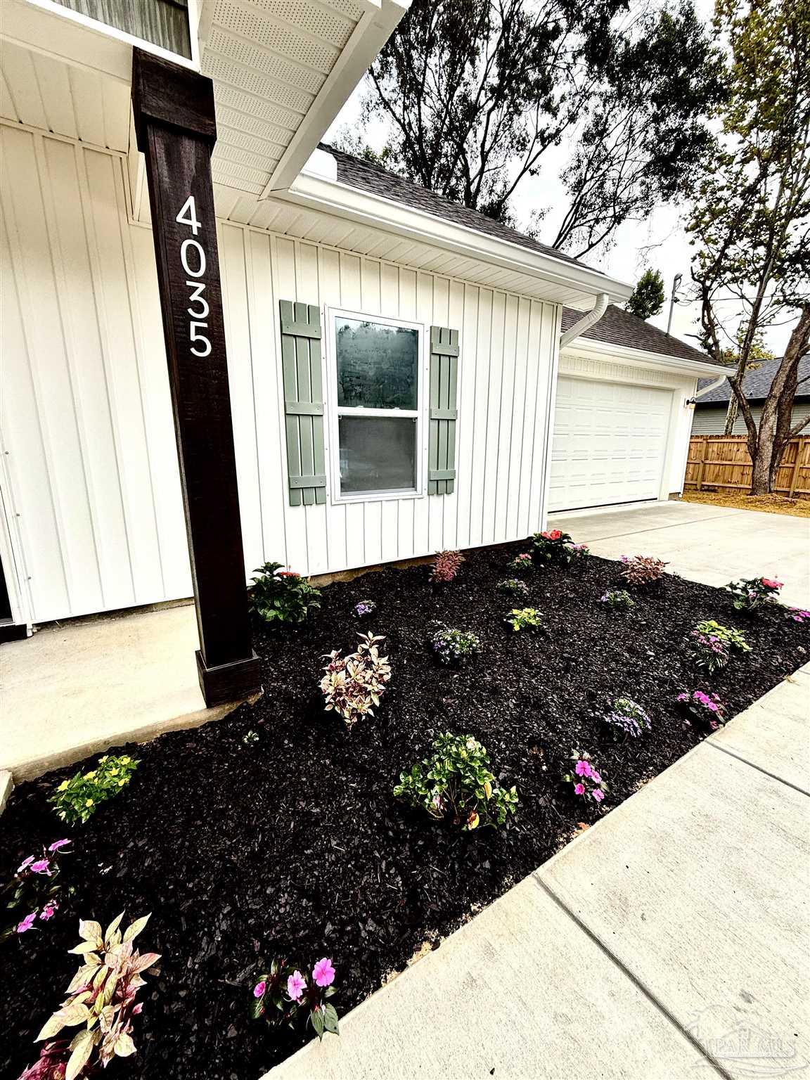 4035 Charles Circle Pace, FL 32571 - Photo 68 of 68 a view of a flower arrangement in backyard