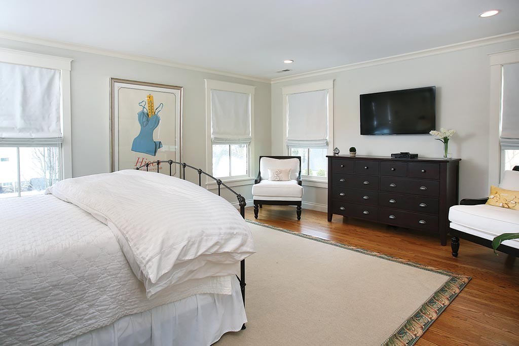 107 Manet Road Newton, MA 02467 - Photo 7 of 10 a bedroom with a bed and a flat screen tv