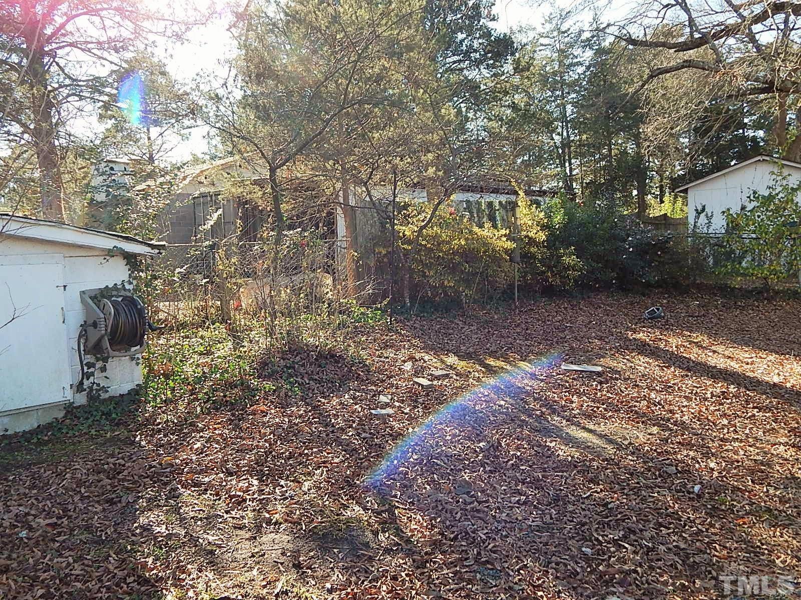 3914 Cheek Road Durham, NC 27704 - Photo 15 of 15 a view of a yard with plants and trees
