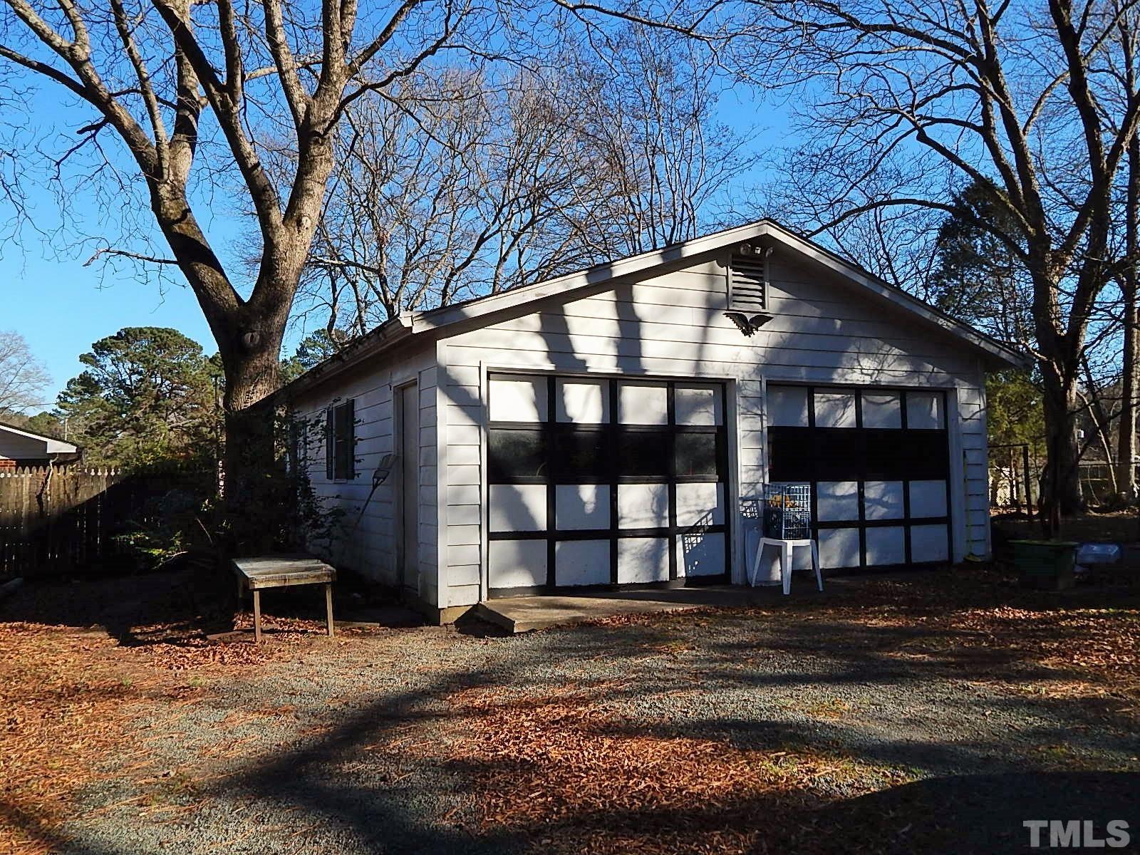 3914 Cheek Road Durham, NC 27704 - Photo 5 of 15 a view of a house with a yard