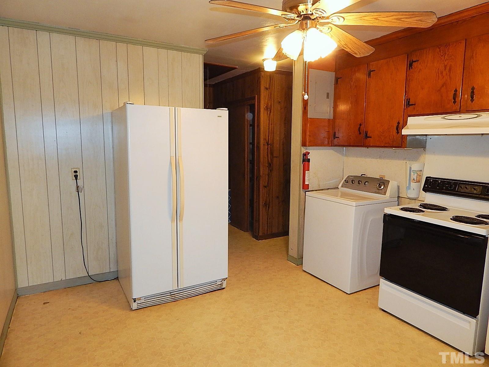 3914 Cheek Road Durham, NC 27704 - Photo 7 of 15 a kitchen with a refrigerator and a sink
