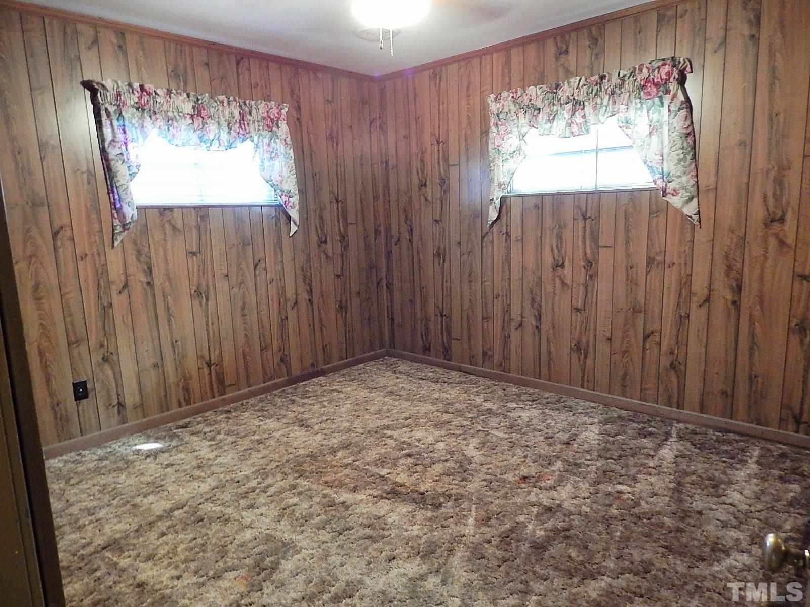 3914 Cheek Road Durham, NC 27704 - Photo 9 of 15 a view of an empty room with a window