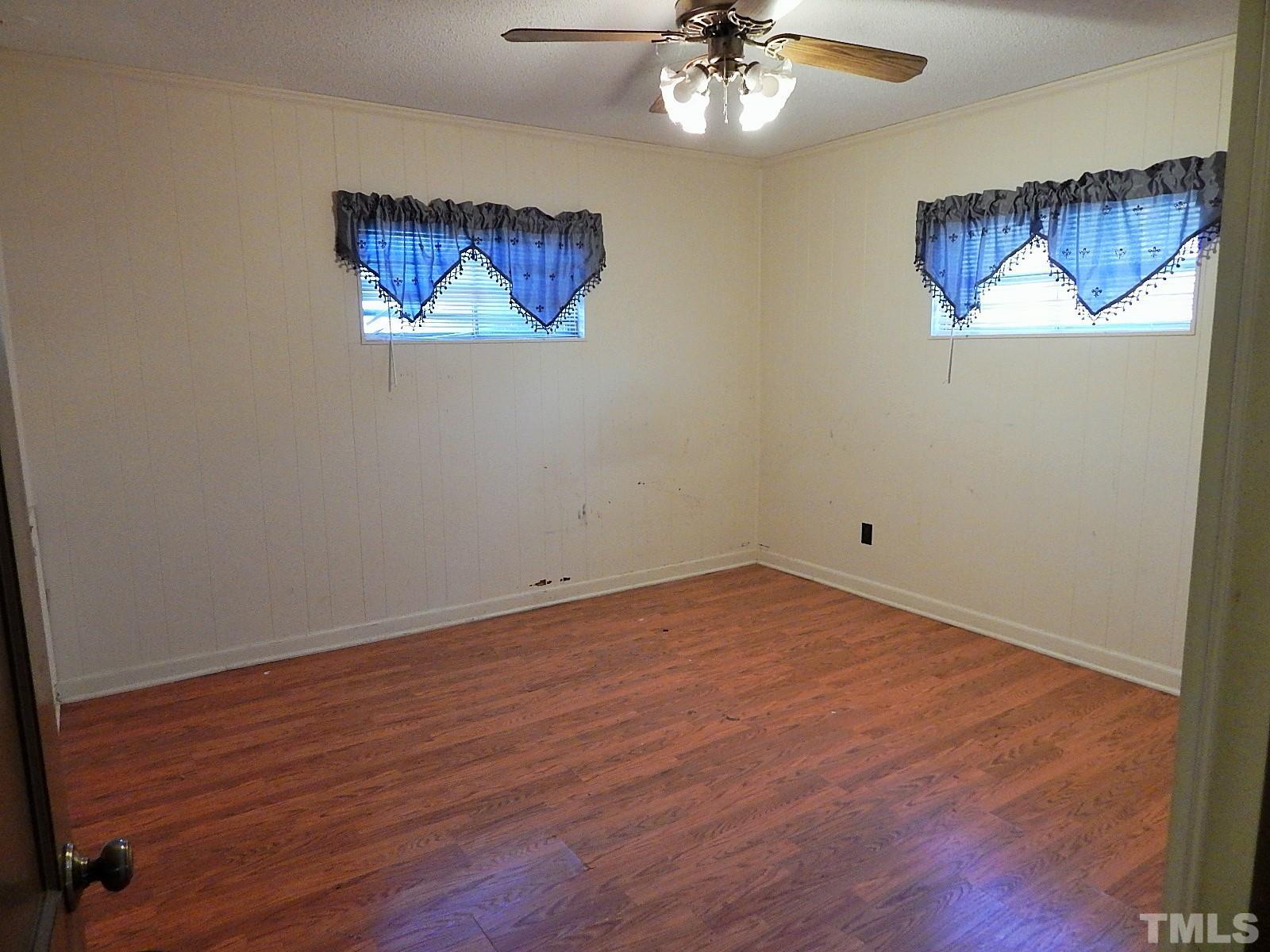 3914 Cheek Road Durham, NC 27704 - Photo 10 of 15 a view of an empty room with a chandelier fan