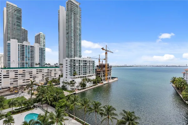 a view of a lake and tall building
