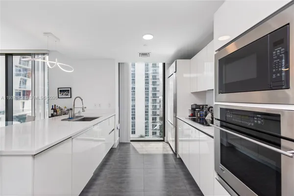 a kitchen with a stove and a sink