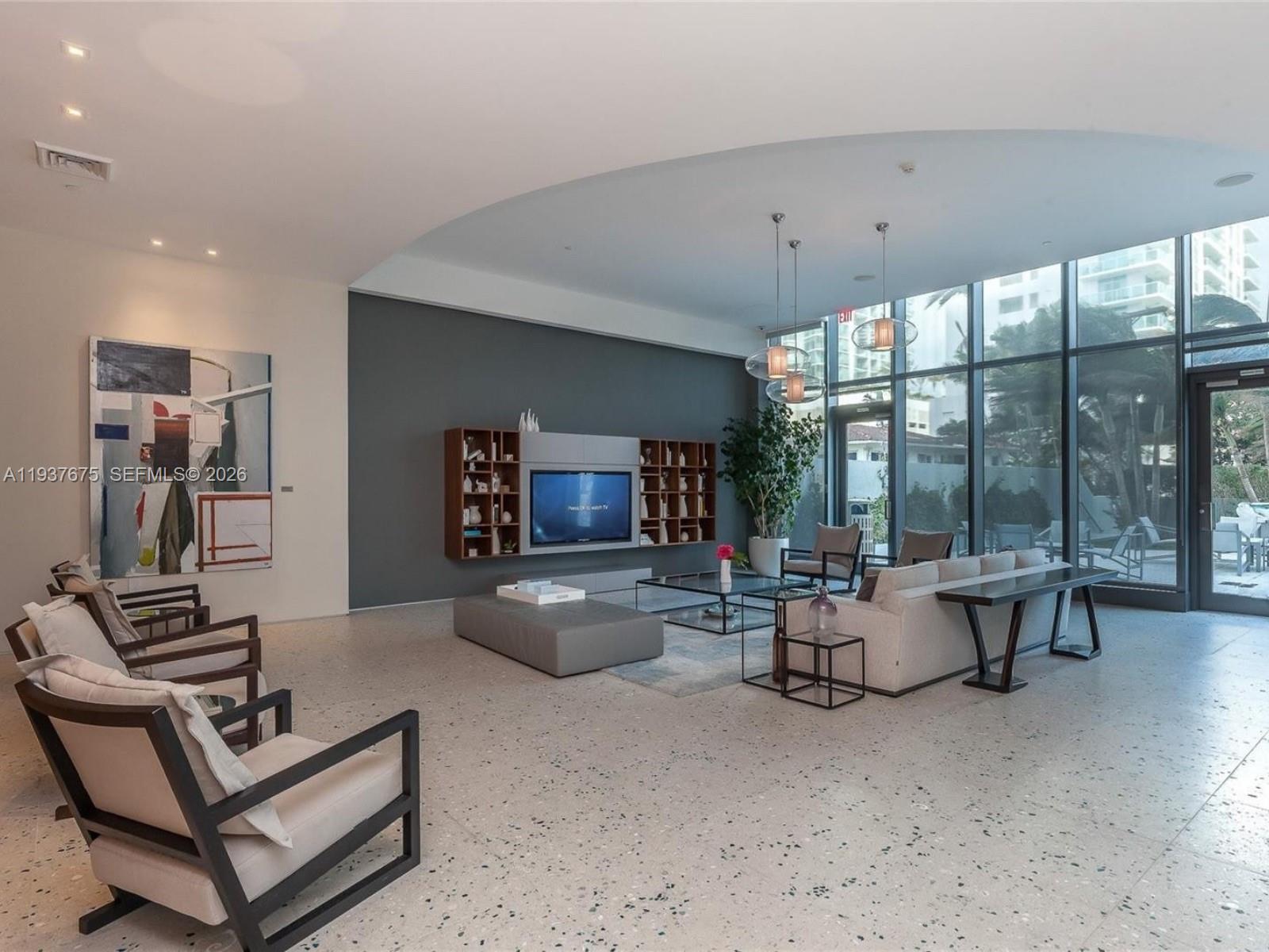 460 Northeast 28th Street, Unit 808 Miami, FL 33137 - Photo 41 of 41 a living room with furniture and a flat screen tv