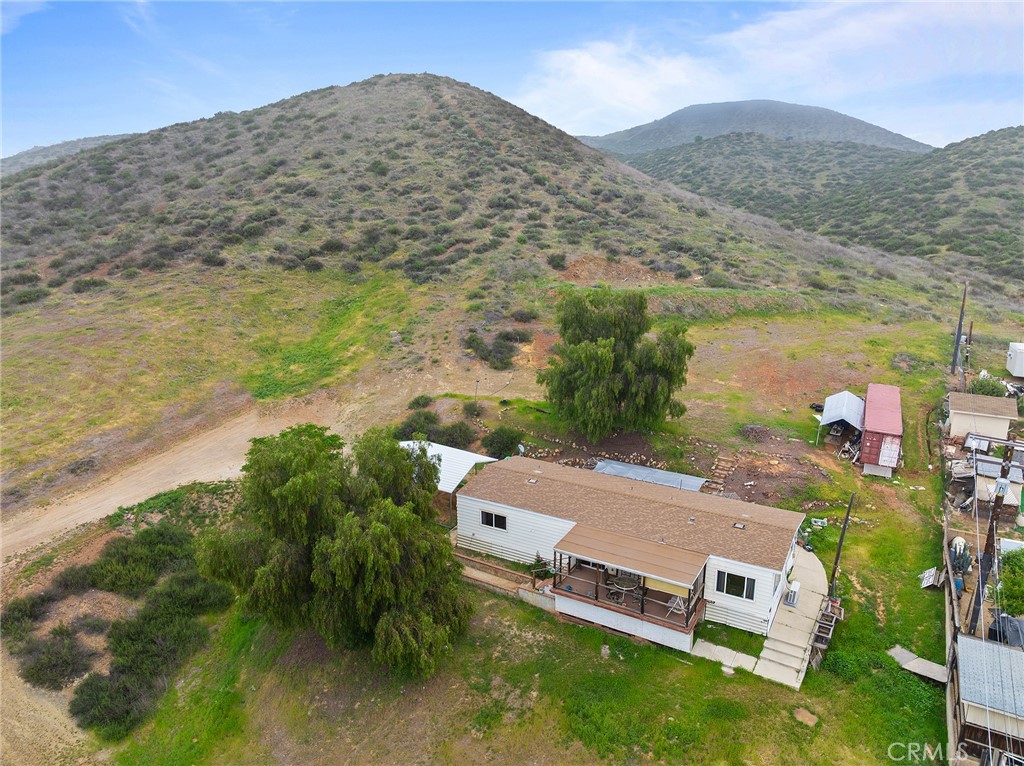 24469 Manzanita Road Menifee, CA 92584 - Photo 1 of 20 an aerial view of residential houses with outdoor space and trees