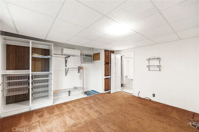 a view of room with wooden floor and windows