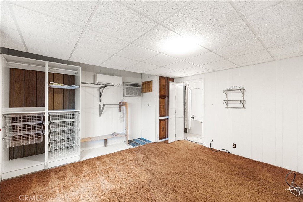 24469 Manzanita Road Menifee, CA 92584 - Photo 12 of 20 a view of room with wooden floor and windows