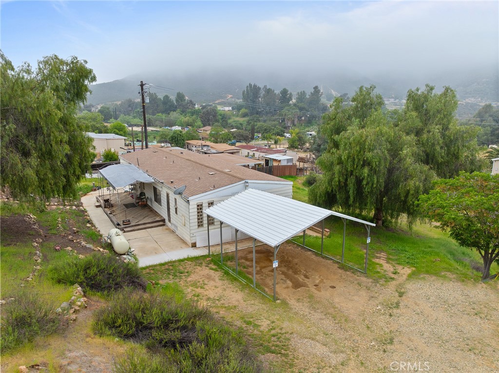24469 Manzanita Road Menifee, CA 92584 - Photo 20 of 20 an aerial view of a house with a yard and lake view