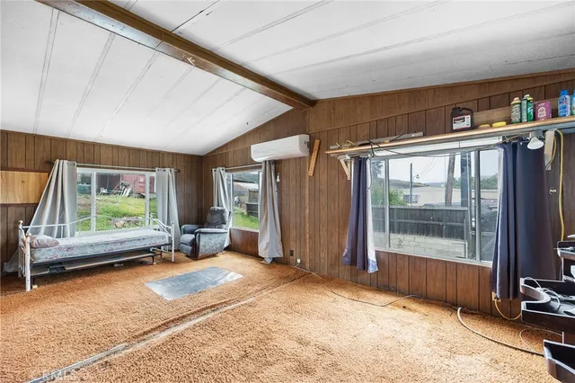 a backyard of a house with garden view and wooden floor