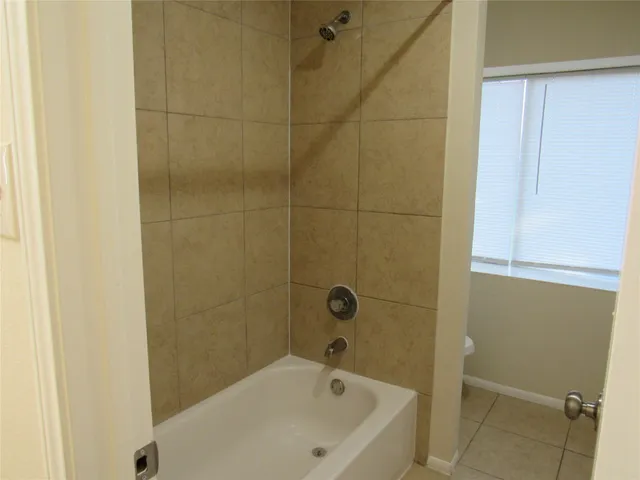 a bathroom with a toilet and a sink