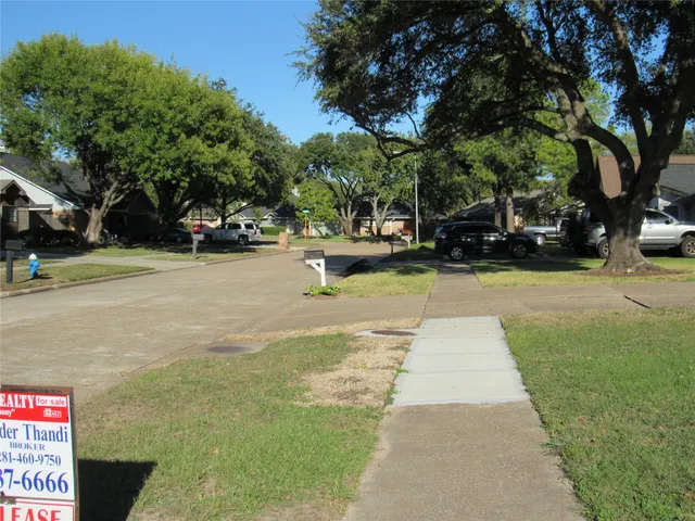 a view of a park with plants and trees