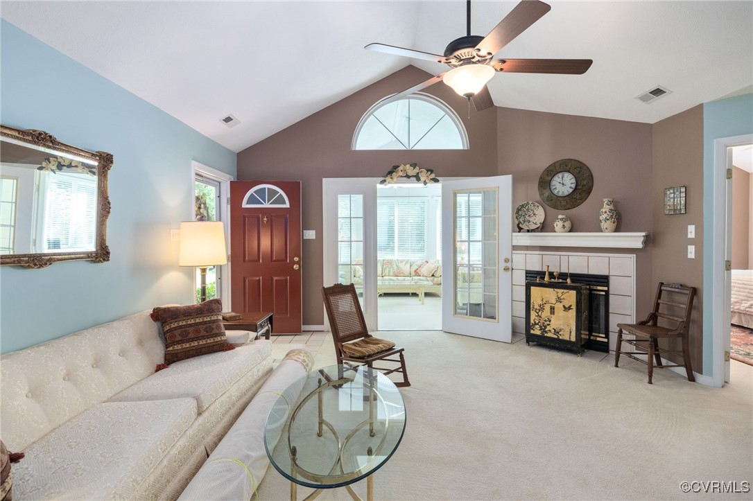 1314 Tannery Circle Midlothian, VA 23113 - Photo 11 of 25 a living room with furniture a fireplace and a chandelier