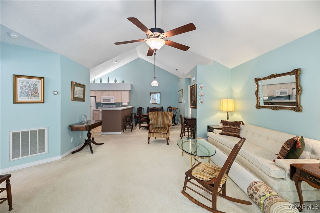 1314 Tannery Circle Midlothian, VA 23113 - Photo 13 of 25 a living room with furniture a clock and a ceiling fan