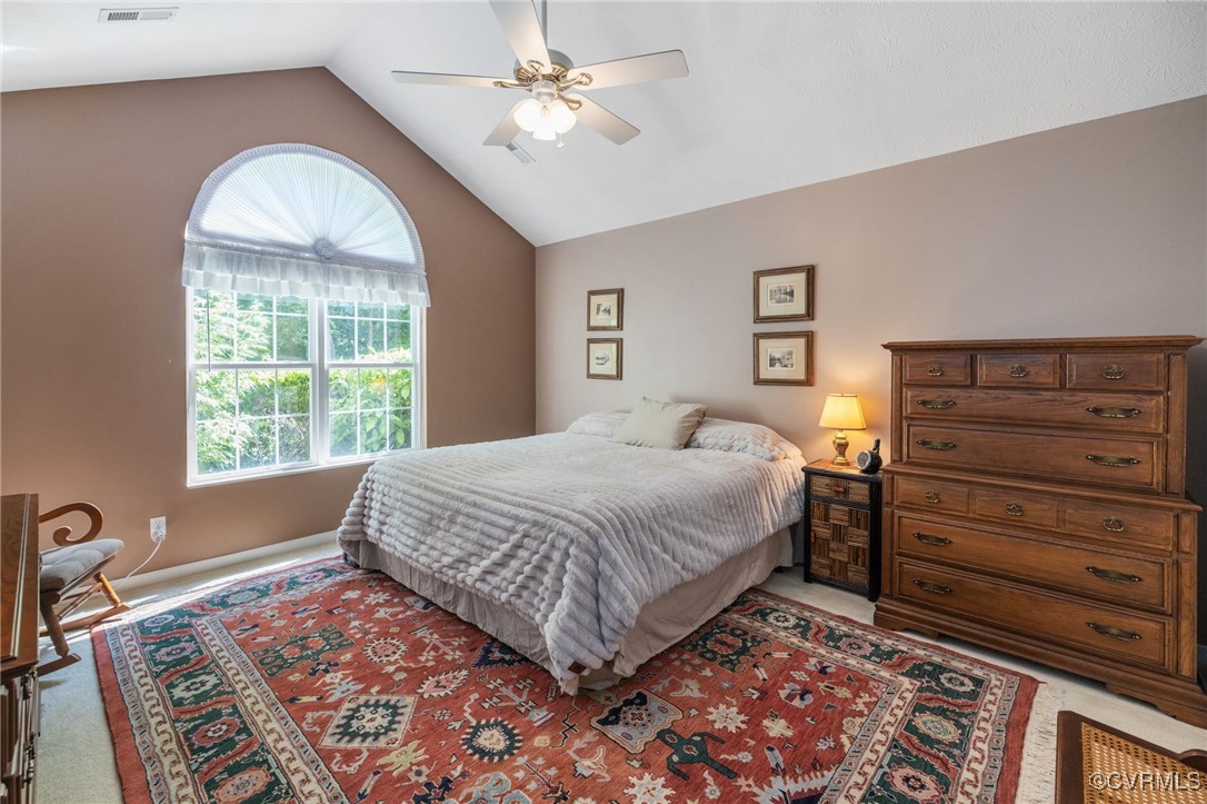 1314 Tannery Circle Midlothian, VA 23113 - Photo 17 of 25 a bedroom with a bed and a chandelier