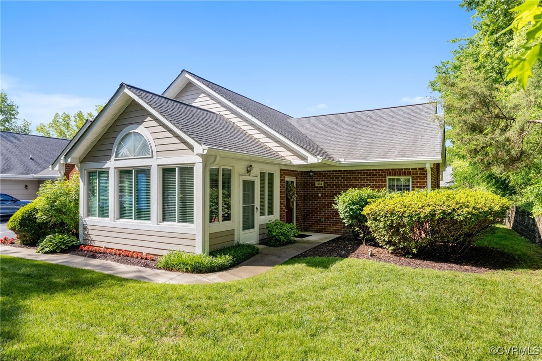 1314 Tannery Circle Midlothian, VA 23113 - Photo 2 of 25 a front view of a house with a yard