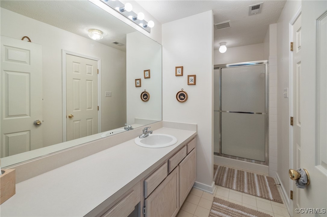 1314 Tannery Circle Midlothian, VA 23113 - Photo 21 of 25 a bathroom with a sink and a mirror
