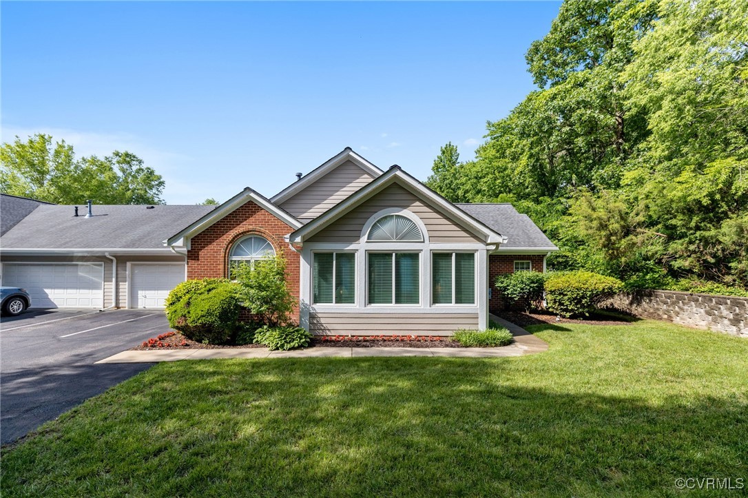 1314 Tannery Circle Midlothian, VA 23113 - Photo 6 of 25 a front view of a house with a yard and garage