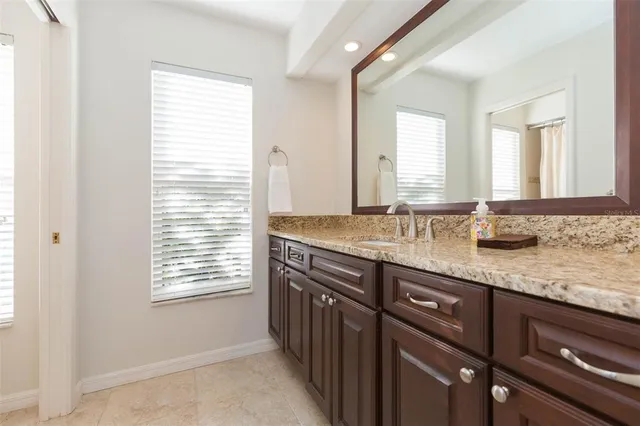 a bathroom with a toilet and a shower curtain