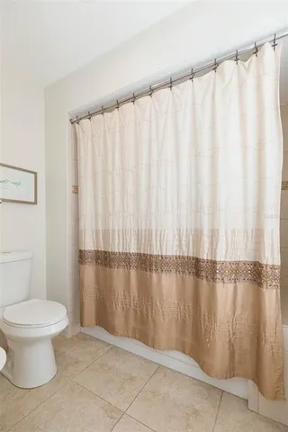 a living room with couch and a large window