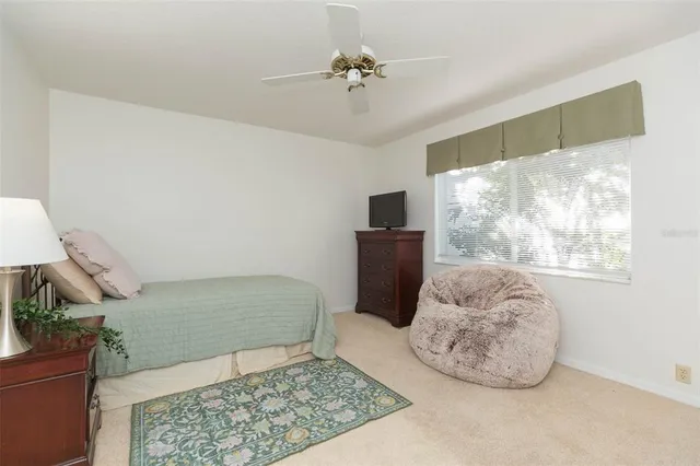 a bedroom with a bed and a dresser in it