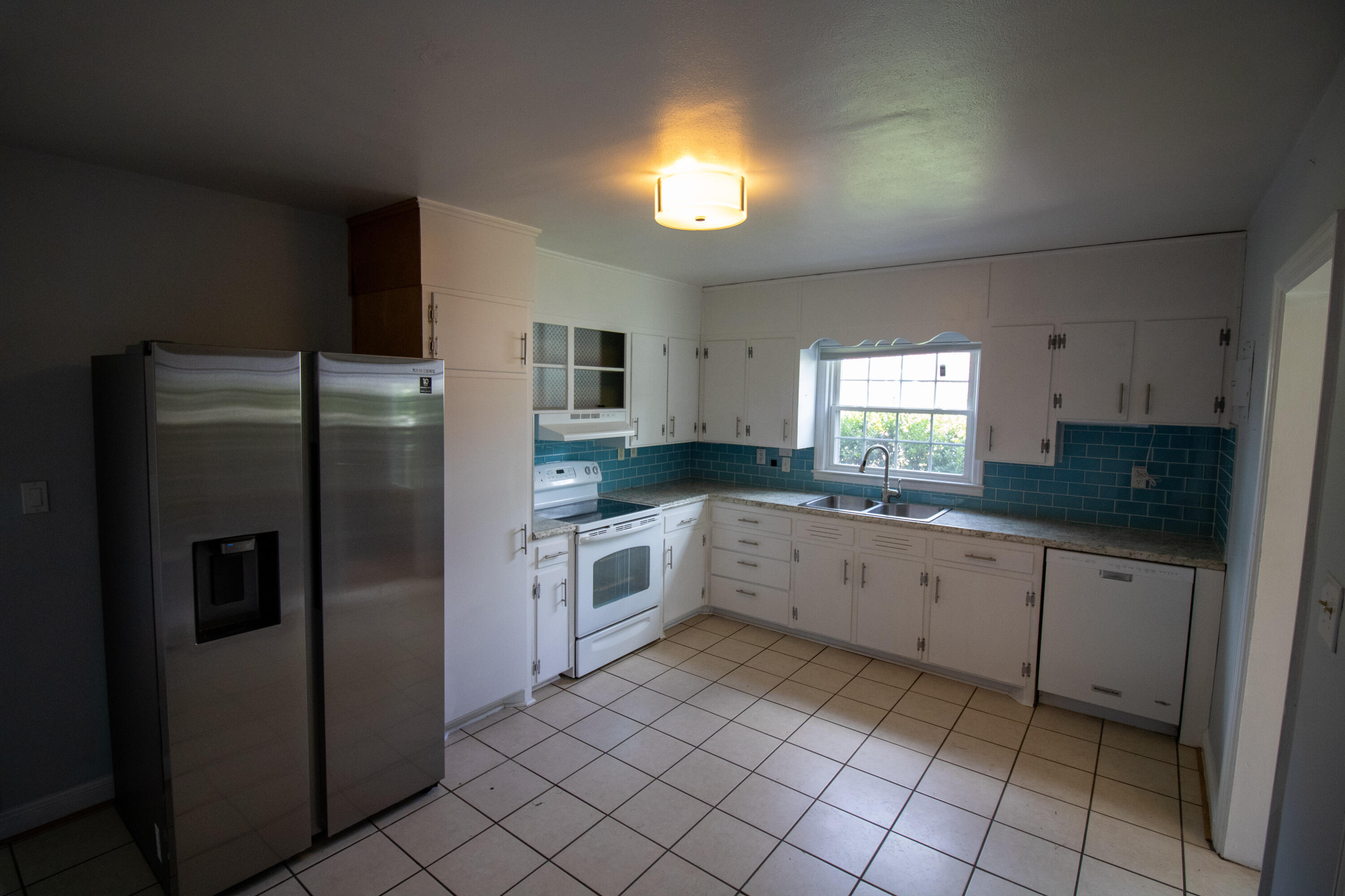 216 Goodwin Avenue Salem, VA 24153 - Photo 7 of 25 a kitchen with a refrigerator sink and cabinets