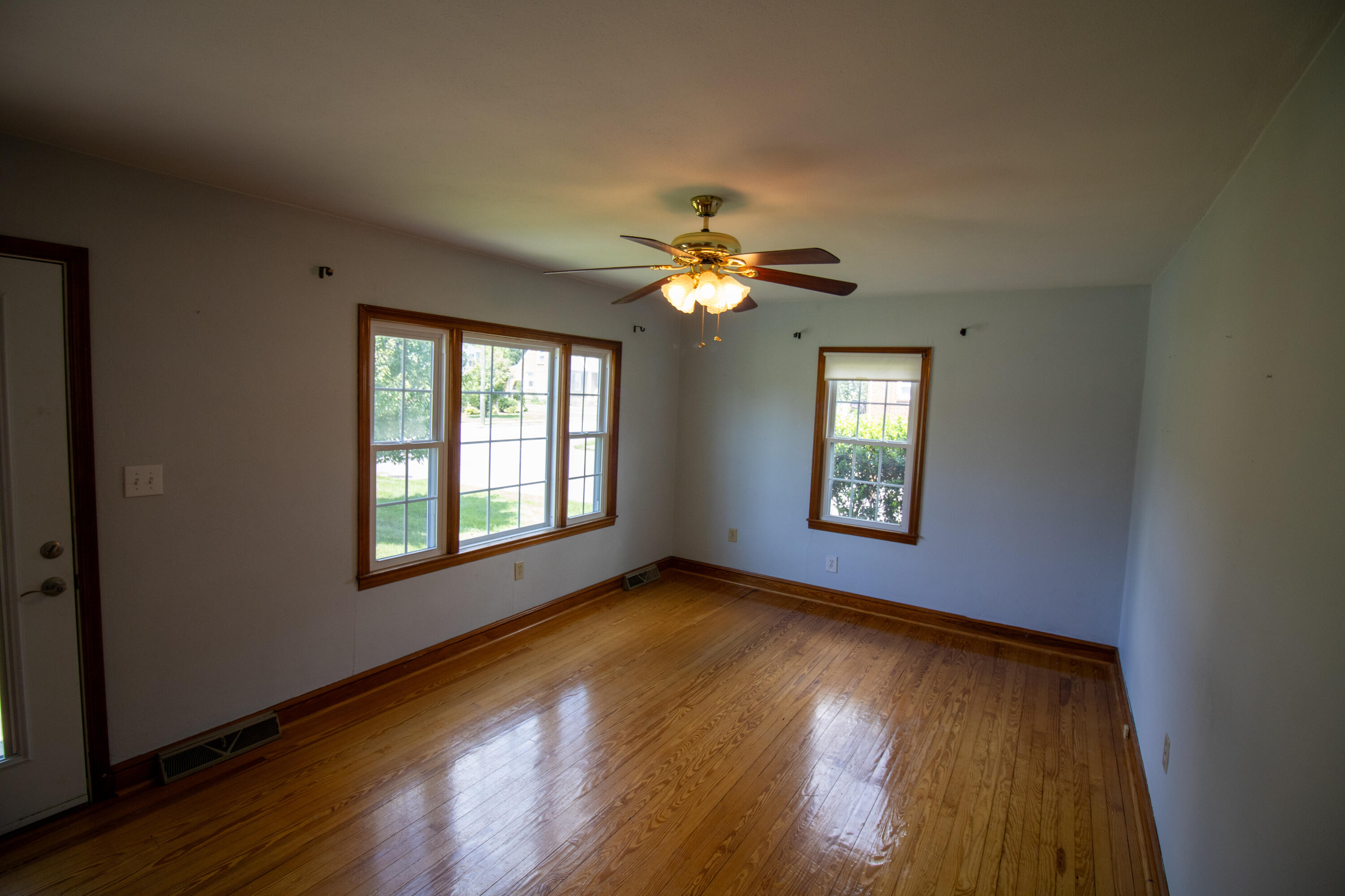 216 Goodwin Avenue Salem, VA 24153 - Photo 8 of 25 a view of an empty room with wooden floor and a window