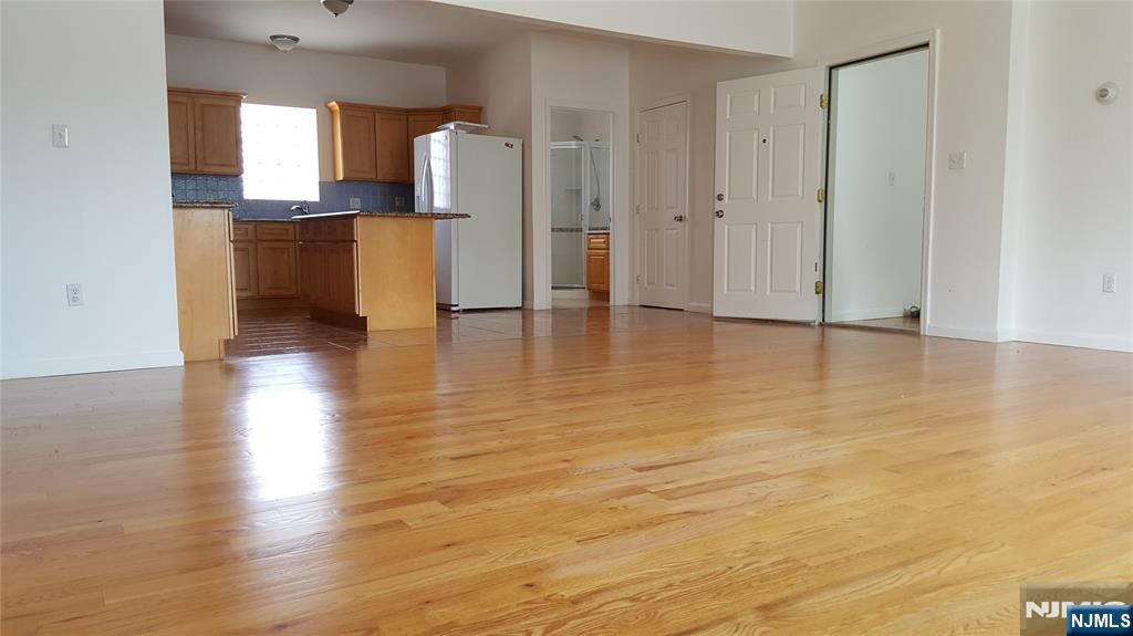 351 Main Avenue Wallington, NJ 07057 - Photo 7 of 9 a view of kitchen view with wooden floor and cabinets