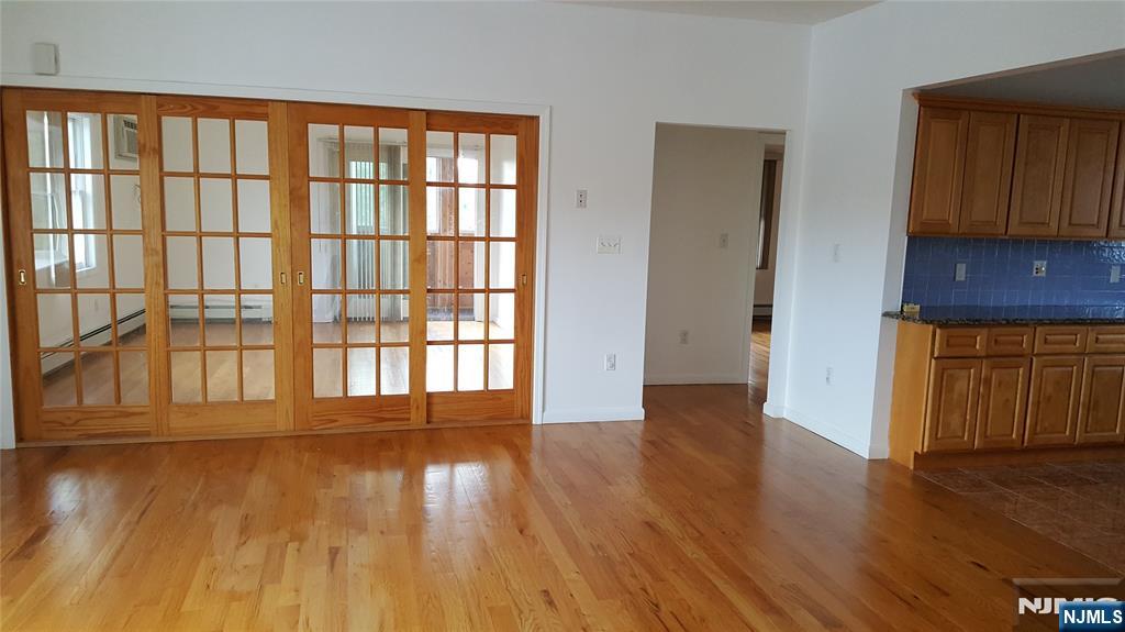 351 Main Avenue Wallington, NJ 07057 - Photo 9 of 9 wooden floor in an empty room with a window