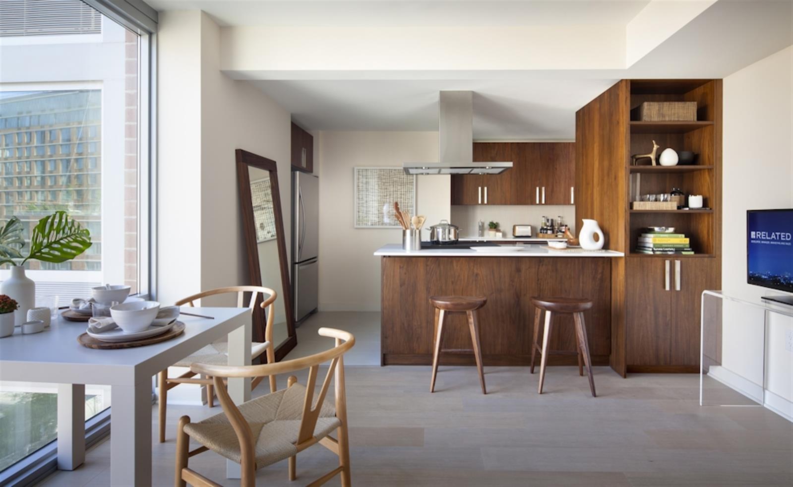 480 Main Street, Unit 20J Manhattan, NY 10044 - Photo 1 of 17 a dining room with furniture a window and kitchen view