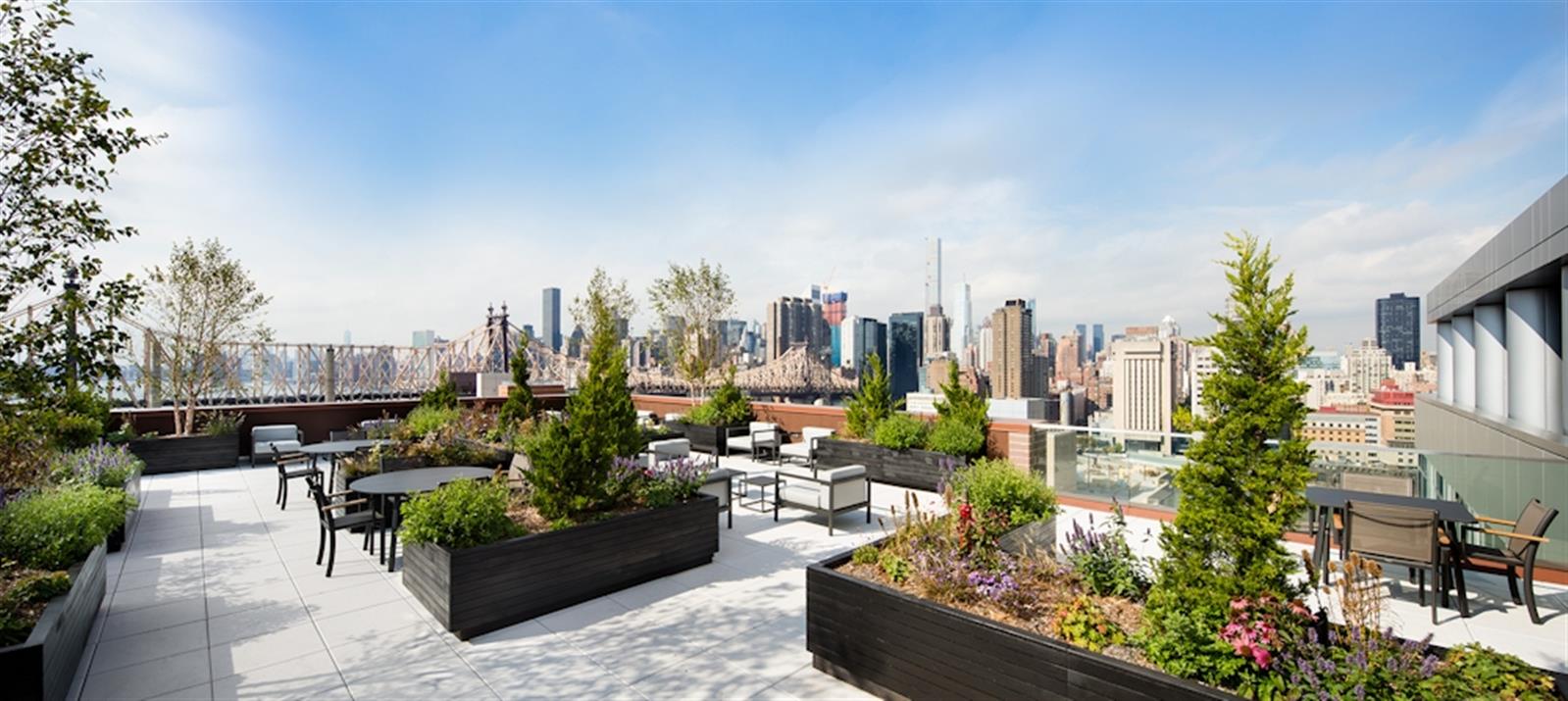 480 Main Street, Unit 20J Manhattan, NY 10044 - Photo 7 of 17 a view of a city with tall buildings