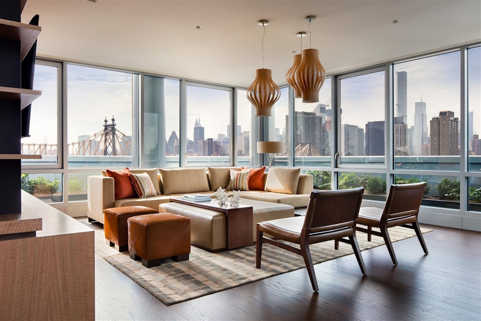 480 Main Street, Unit 20J Manhattan, NY 10044 - Photo 9 of 17 a living room with furniture large window and a table