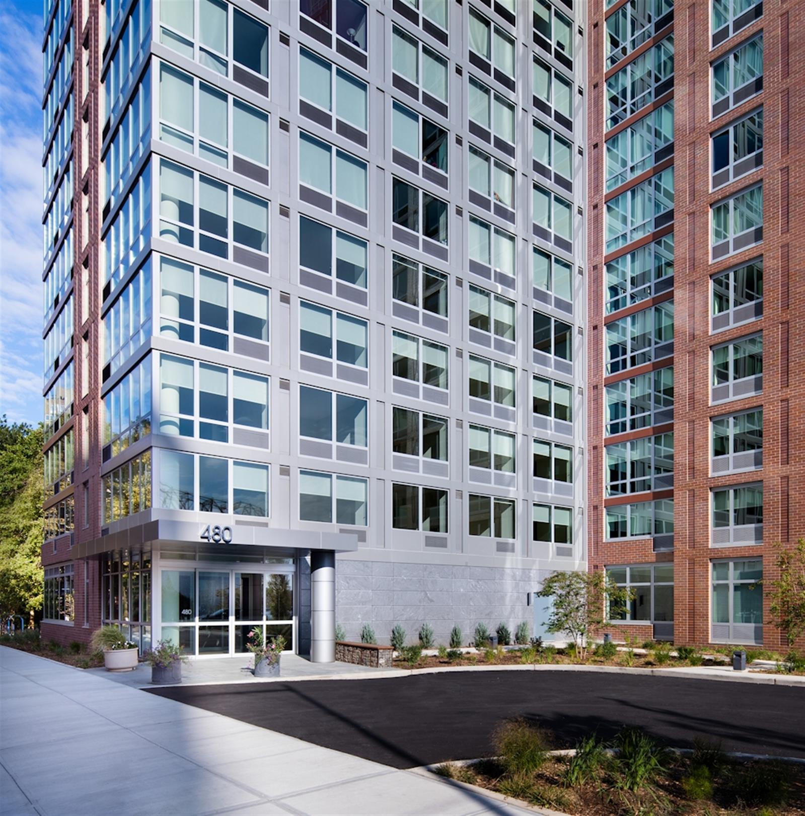 480 Main Street, Unit 20J Manhattan, NY 10044 - Photo 10 of 17 front view of a building with a street
