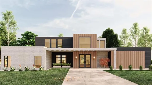 a front view of a house with a garden