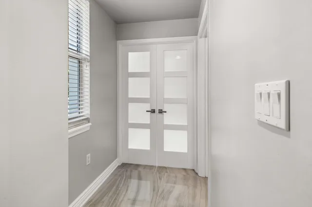 a view of a room with a ceiling fan