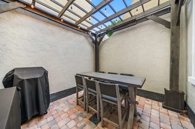 a view of a dining room with furniture and a window