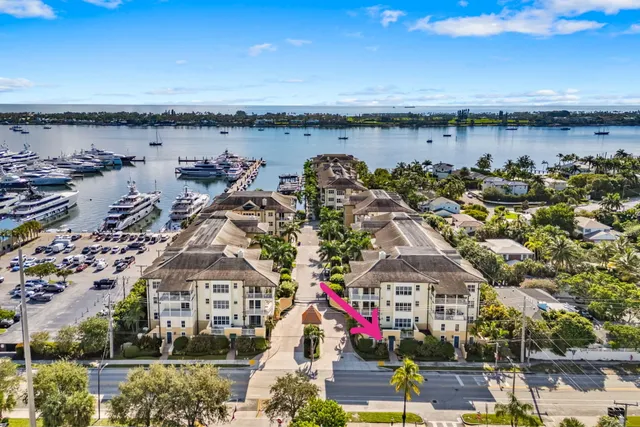 an aerial view of a house with a yard and swimming pool