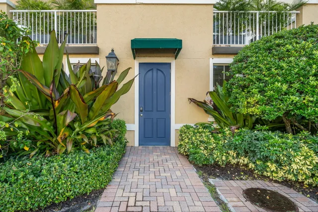 a house with a plant in front of it