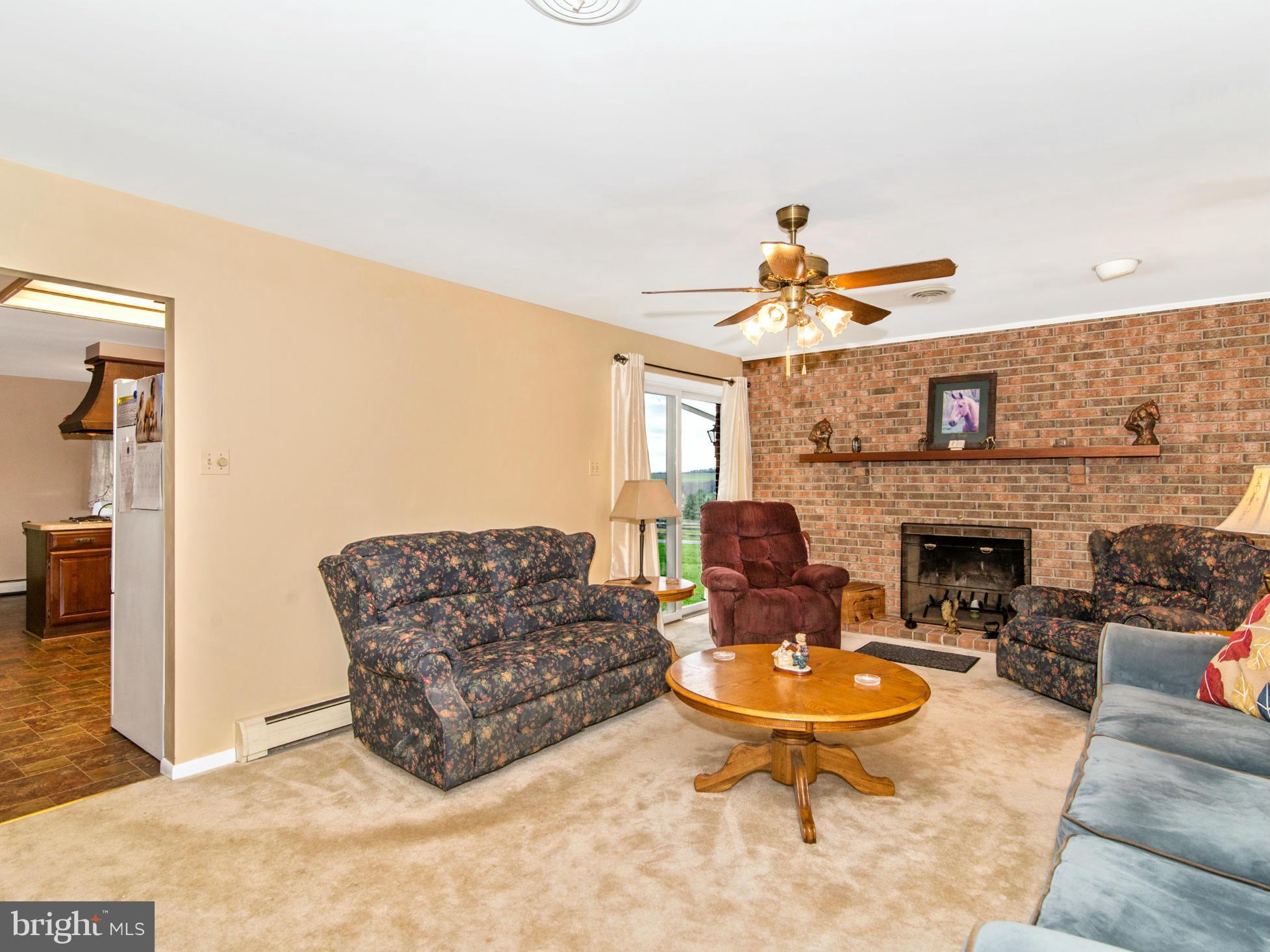 14040 Liberty Road Union Bridge, MD 21791 - Photo 11 of 30 a living room with furniture a fireplace and a table