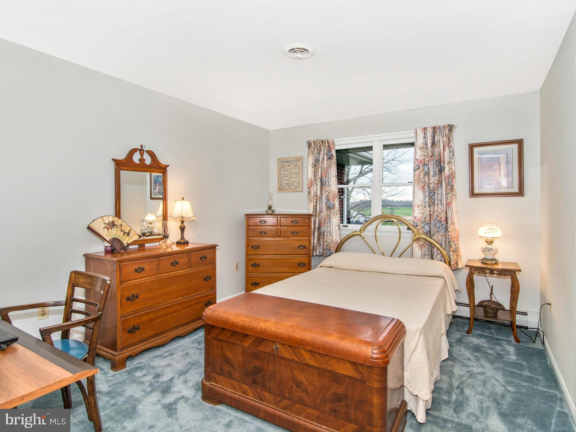14040 Liberty Road Union Bridge, MD 21791 - Photo 14 of 30 a bedroom with a bed and a mirror on dresser