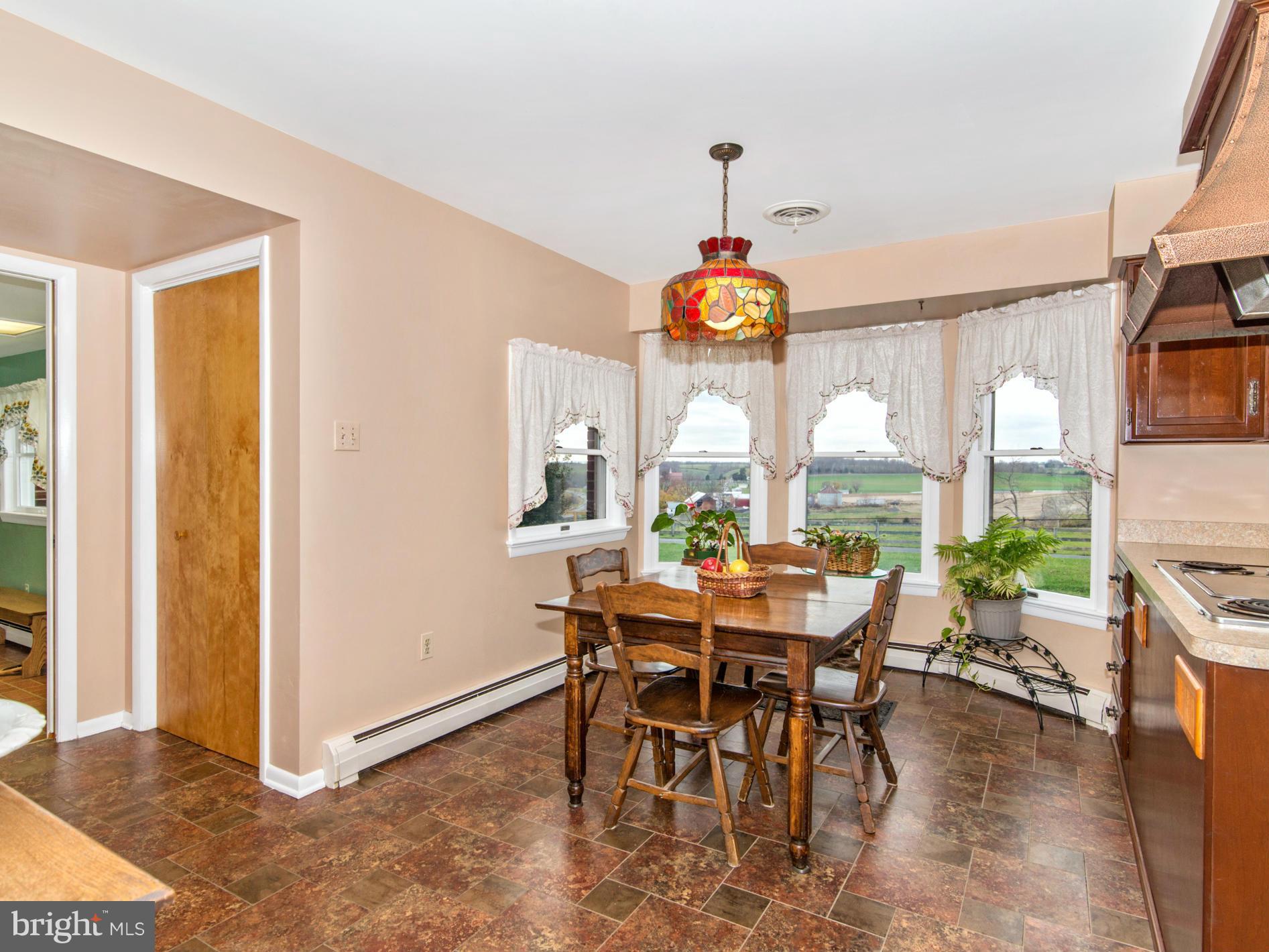 14040 Liberty Road Union Bridge, MD 21791 - Photo 7 of 30 a view of a dining room with furniture a livingroom and chandelier